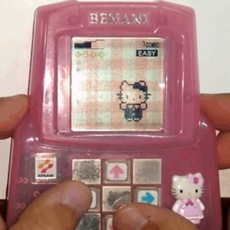 A person is playing Hello Kitty DDR.