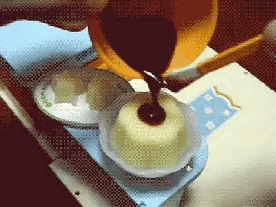 Chocolate being added onto the pudding