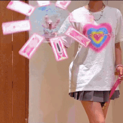 A person spinning magical cards in a circle.